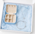 Silver bow jewelry gift box with necklace, bracelet and mini travel jewelry case